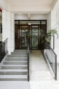 a set of stairs leading to a front door at San Agustin Residences in Manila