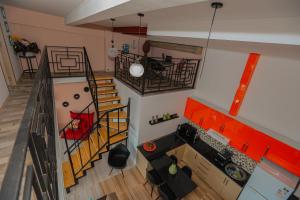 an overhead view of a living room with a staircase at Black see apartment in Kobuleti