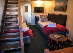 Postel nebo postele na pokoji v ubytování The Park Hotel Ruapehu