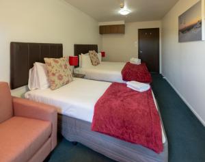 Postel nebo postele na pokoji v ubytování The Park Hotel Ruapehu