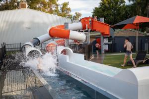 a water slide at a water park with people playing at NRMA Mildura Riverside Holiday Park in Mildura