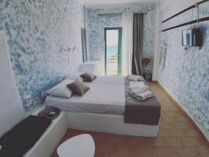 Postel nebo postele na pokoji v ubytování Filio Guesthouse