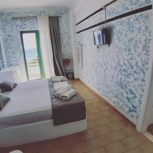 Postel nebo postele na pokoji v ubytování Filio Guesthouse