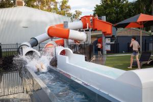 a water slide at a park with people playing at NRMA Mildura Riverside Holiday Park in Mildura