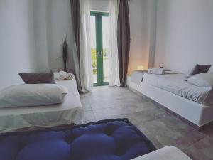 Postel nebo postele na pokoji v ubytování Filio Guesthouse