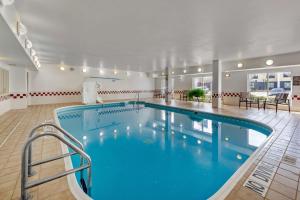 a large swimming pool in a hotel room with a pool at Comfort Inn Oklahoma City South - I-240 in Oklahoma City