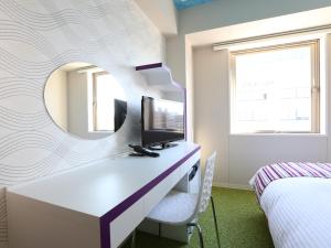 Postel nebo postele na pokoji v ubytování KOKO HOTEL Higashiosaka - formerly Hotel Wing International Select Higashi Osaka