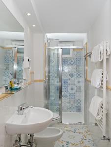 a bathroom with a sink and a shower at Hotel Il Girasole in Anacapri
