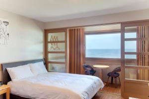 Postel nebo postele na pokoji v ubytování Fantastic Ocean View Sydney Hotel + 37 fotografií