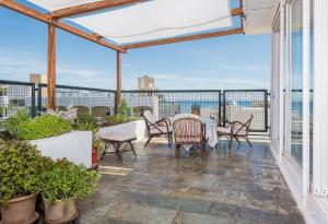 A balcony or terrace at Panoramic view roof garden apartment