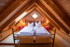 a bedroom with a bed in the attic at Haus Seeblick in Herrsching am Ammersee