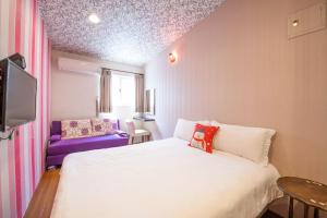 Postel nebo postele na pokoji v ubytování Luodong Nightmarket Homestay + 11 fotografií