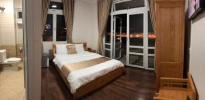 Postel nebo postele na pokoji v ubytování Spring Hotel