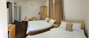 Postel nebo postele na pokoji v ubytování Spring Hotel