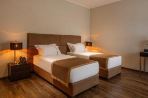 Postel nebo postele na pokoji v ubytování LETO Boutique Hotel Zugdidi