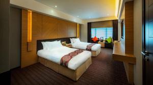 Voodi või voodid majutusasutuse Rio Hotel toas