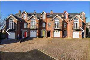 a large brick house with a large driveway at 14 Millstone Court in Portstewart