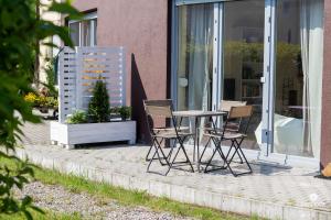 Fotografia z galérie ubytovania Jantar Apartamenty - Rodzinny apartament z ogrodem v destinácii Grzybowo