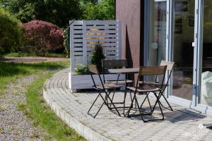 Fotografie z fotogalerie ubytování Jantar Apartamenty - Rodzinny apartament z ogrodem v destinaci Grzybowo