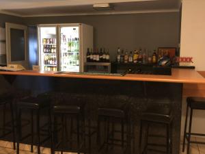 a kitchen with a bar and a counter top at True Blue Motor Inn in Rockhampton