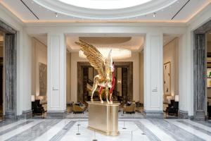 a large lobby with a statue of an eagle in the center at Paradise City in Incheon