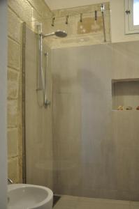 a bathroom with a shower and a sink at Sole e Mare in Favignana