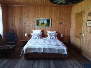 Кровать или кровати в номере Guest house Usadba Surikova