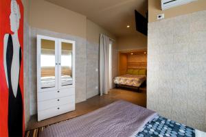 マスカルチーアにあるIl Giardino di Agataのベッドルーム1室(ベッド1台、ベッドルーム1室付)