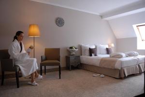 Postel nebo postele na pokoji v ubytování Hotel Quartier Latin