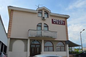 a motel sign on the side of a building at Motel Signal in Banja Luka