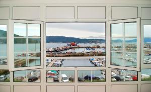 a view of a marina from the window of a building at Pensión Residencia J. Lago in Muros