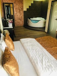 Postel nebo postele na pokoji v ubytování Hotel Angellis