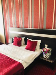 Postel nebo postele na pokoji v ubytování Hotel Angellis