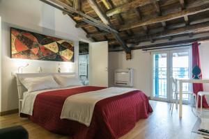 מיטה או מיטות בחדר ב-Corte del Merlo