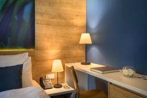 Ein Bett oder Betten in einem Zimmer der Unterkunft Remisens Hotel Epidaurus-All inclusive