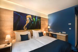 Ein Bett oder Betten in einem Zimmer der Unterkunft Remisens Hotel Epidaurus-All inclusive