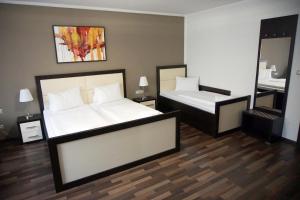 Postel nebo postele na pokoji v ubytování Hotel Corona