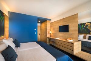 Ein Bett oder Betten in einem Zimmer der Unterkunft Remisens Hotel Epidaurus-All inclusive
