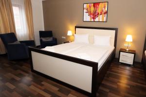 Postel nebo postele na pokoji v ubytování Hotel Corona