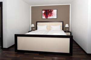 Postel nebo postele na pokoji v ubytování Hotel Corona