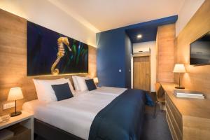 Ein Bett oder Betten in einem Zimmer der Unterkunft Remisens Hotel Epidaurus-All inclusive