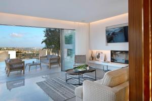 a living room with a view of the city at Elea Silver Villa in Peyia