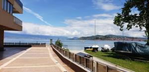 a house with a view of a body of water at Park Beach Apartments in Ohrid