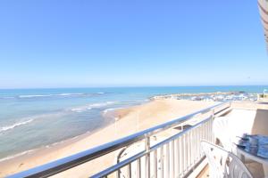 a view of the beach from the balcony at Casa Donna Titina in Punta Secca