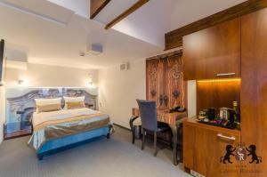 Łóżko lub łóżka w pokoju w obiekcie Celestin Residence