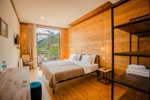 Postel nebo postele na pokoji v ubytování Chalet Mestia