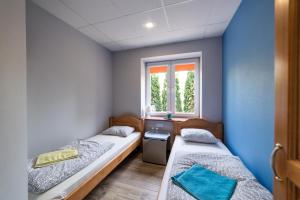 Posteľ alebo postele v izbe v ubytovaní Hostel Filip