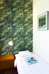 Postel nebo postele na pokoji v ubytování Hotel Finn