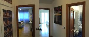 a hallway with two doors leading to a room at AppleCat in Rome +30 photos