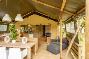 a living room and kitchen of a tiny house at Lodge Holidays - Al Lago di Lago in Lago
